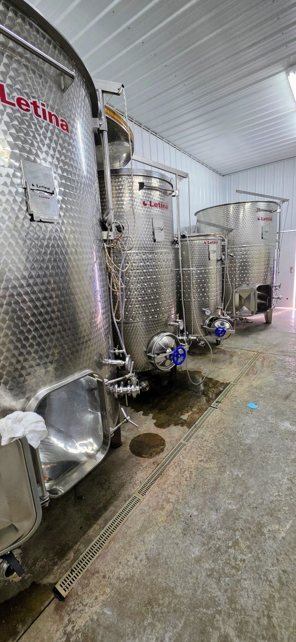 Stainless steel fermentation tanks at Apple Creek Winery